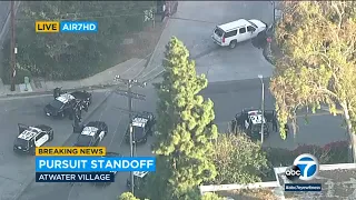 Man in bullet-riddled LADWP vehicle in dramatic standoff with LAPD