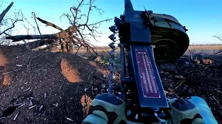 A Ukrainian soldier fires an AGS-17 "Plamya" automatic grenade launcher on Russian enemy targets