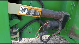 Fixing the knife actuator on the John Deere 459 Silage Special baler