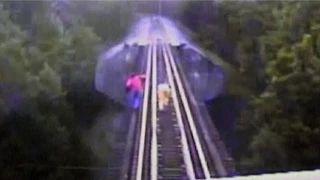 Women narrowly escape deathby diving under train while crossing US rail bridge