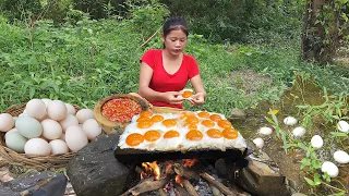 Yummy! Duck egg grilled on rock with Chili sauce for dinner - Survival cooking in forest