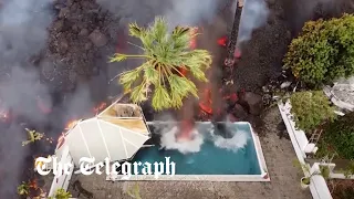 La Palma volcano: Lava pours into swimming pool and causes water to boil