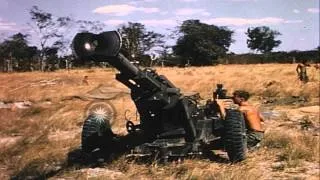 A soldier setting up an M-102, 105mm Howitzer in field during Operation Big Sprin...HD Stock Footage