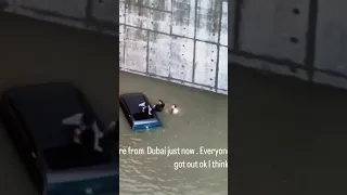 rescue service/flood/sink/car/escape/dubai city/dubai/heavy rain/bad weather/extreme weather/uae