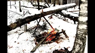 Bushcraft survival. Cooked dumplings in a snow shelter.