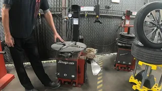 Dismounting and mounting a tire using a Snap-on tire changer