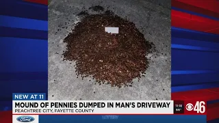 Mounds of pennies dumped in man's driveway