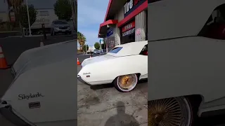 Buick Skylark Convertible on Vogues Daytons Custom Pearl White Paint #SpokesAndVogues #Buick