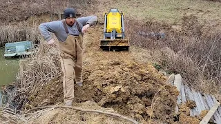 Installing new overflow pipe in pond