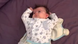 Cute baby stretching after sleep