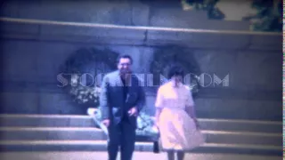 1963: Italian couple street lady dress blows up like Marilyn Monroe.  ROME, ITALY