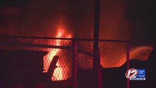 Dozens of cars burn in fire at North Providence salvage yard