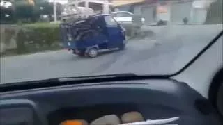 Overloaded 3-wheeler pick up fails to climb a hill