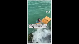 Palestinians Collect Food Parcels at Sea #short #shorts