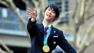 Gold medalist Hanyu returns home to massive parade in Sendai