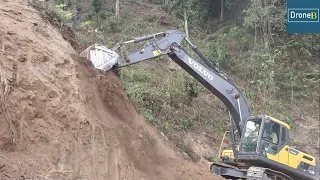 Widening Hilly Narrow Busy Rough Road-Volvo Excavator
