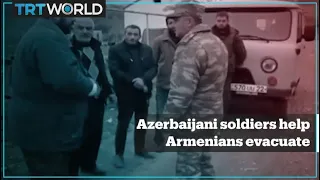 Azerbaijani soldiers help Armenian villagers in Aghdam evacuate