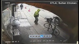 Man shoves stranger into path of box truck