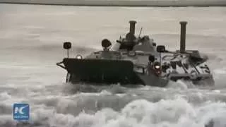 RAW: BTR-80s crash through waters for Russia's Centre-2015 mass military drills