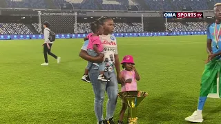 Victor Osimhen takes picture with family friends with Italian league trophy.