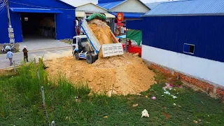 Great job! New foundation house dozer pushing soil delete grass mud with dump trucks unloading