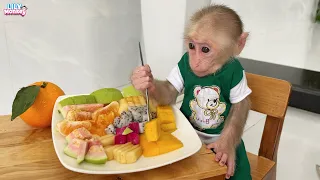 Monkey Lily enjoys a fruit party made by dad