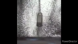 Magnetic field visualisation in slow motion using iron dust and powerful magnet