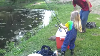 little girl catches big fish