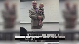 Professor holds single mother's toddler