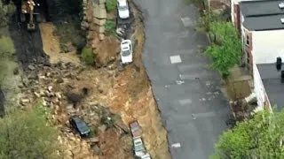 Heavy rains lash the US East Coast, cause street collapse