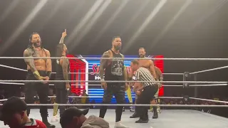 ROMAN REIGNS REACTS TO FAN SIGN SAYING HE SITS WHEN HE PEES