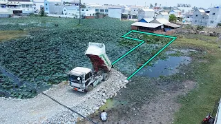 Dozer operator D20 & Truck 5ton pushing stone into pond and Soil compaction