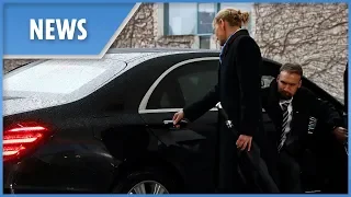 Theresa May gets locked in her car as she arrives to meet Merkel
