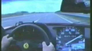 Ferrari F40 driving at 180 mph on a highway