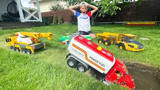 Alex Builds a Bridge from Blocks with Tractor Power Wheels and Big truck. Funny story cars toy