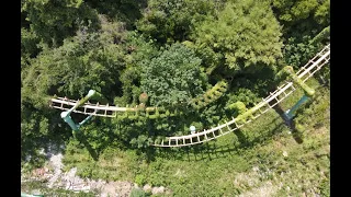 Abandoned Suspended Looping Coaster remnant exploration 4K drone view Suzhou Amusement Land