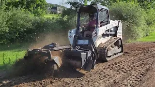 Bobcat harley rake attachment in action up in Oxford, Mi