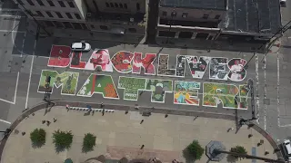 Artists refresh Plum Street 'Black Lives Matter' mural