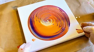 Orange and purple swirl painting - acrylic pour tree ring technique for RDS/CRPS awareness