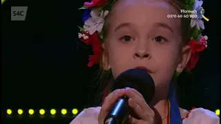 Amelia Anisovych sings The Ukrainian National Anthem at Côr Cymru 2022