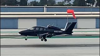 All black Cirrus G2+ vision jet landing at Santa Monica airport