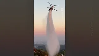 Watch This Helicopter Drop Water to Help Extinguish Fires