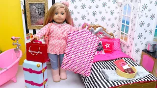 American girl unpacking doll clothes from suitcases - PLAY DOLLS travel routine