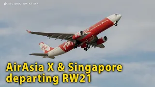 AirAsia X (9M-XXQ) and Singapore Airlines (9V-SHT) departing RW21 at Perth Airport.