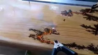 Electricity finding the path of least resistance on a piece of wood