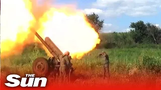 Pro-Russian LPR militia blast Ukrainian stronghold with a battery of howitzers