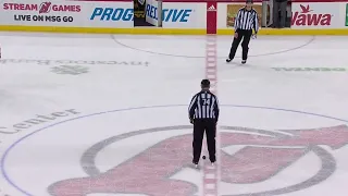 Ref drops puck for faceoff with NO PLAYERS.