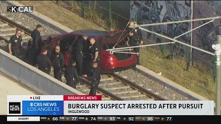 Burglary suspect ditches car on Metro train tracks during hectic chase