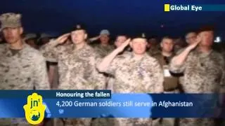 German soldiers serving with NATO forces in Afghanistan hold memorial for fallen comrade