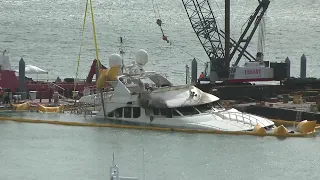 Work continues to remove Marc Anthony's yacht that caught fire from marina